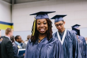 Students in graduation gowns at commencement.