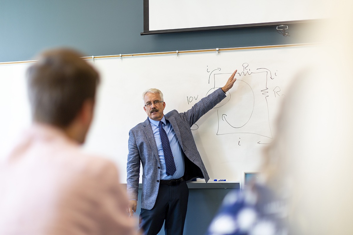Professor teaching engineering class