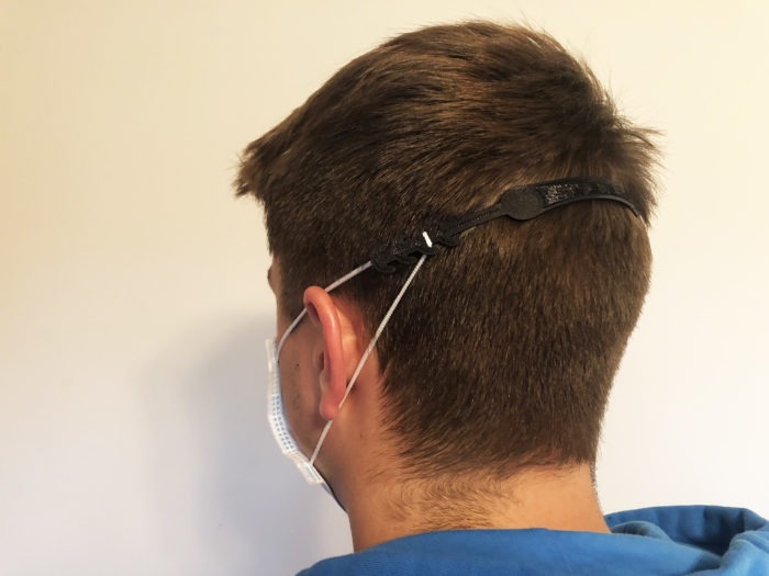 Spring Arbor student models the headband he created to attach to face masks for healthcare workers to wear