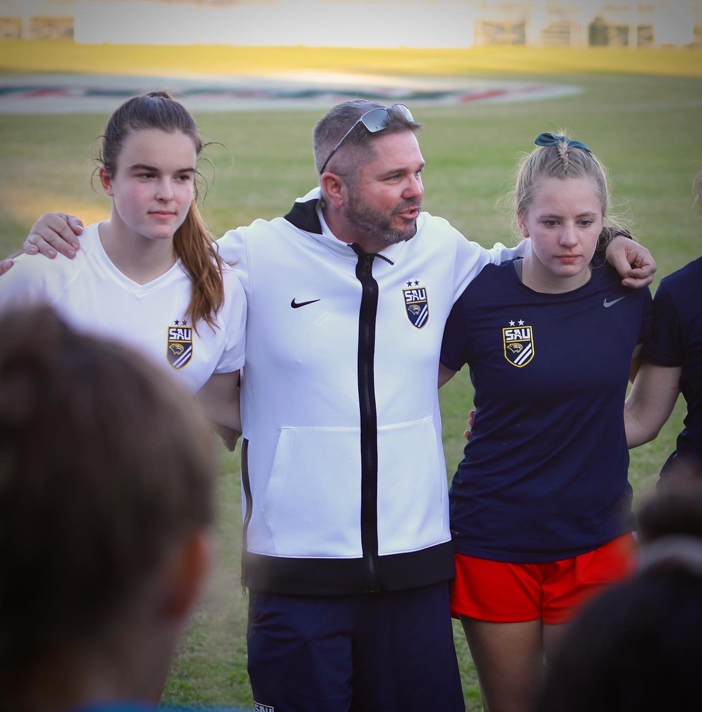 Athletic Director Jason Crist with athletes