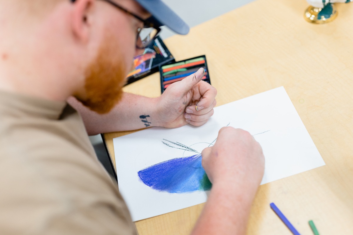 A student painting in class.