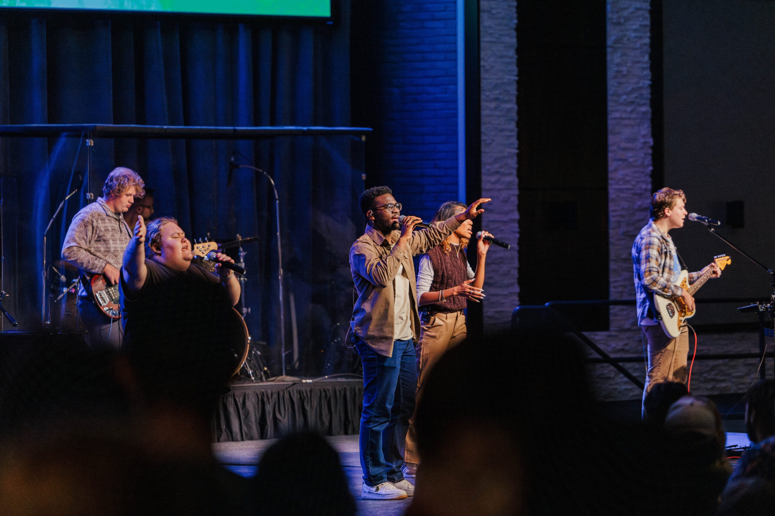 Students leading student body in worship